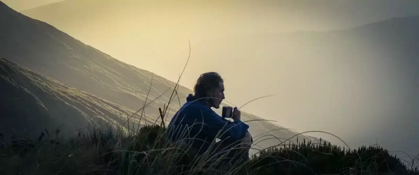 man holding cup